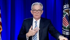 US Fed cuts bond-buying, plans for rate rises