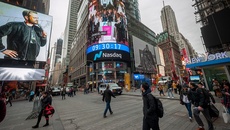 Nasdaq sets fresh record high despite safe haven demand