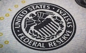 Gold price unmoved as Fed plays down tapering