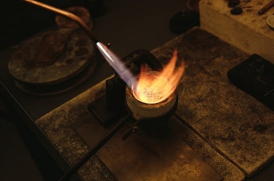 Melting gold in a crucible for smelting