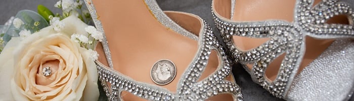 A silver sixpence in a bride's shoe.