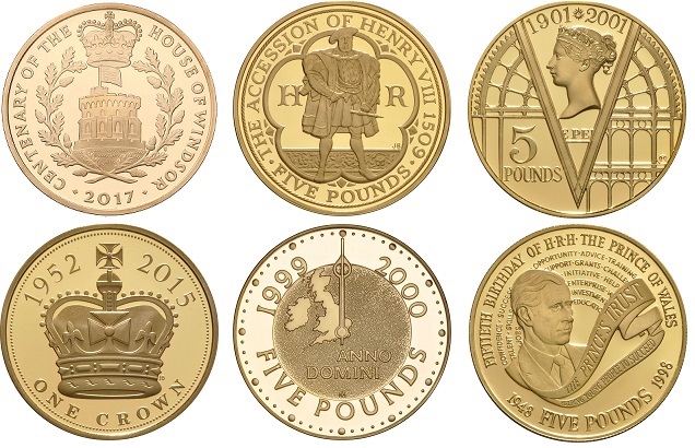 A selection of gold £5 commemorative coins.