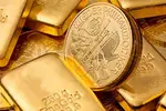 close up of gold coins and bars